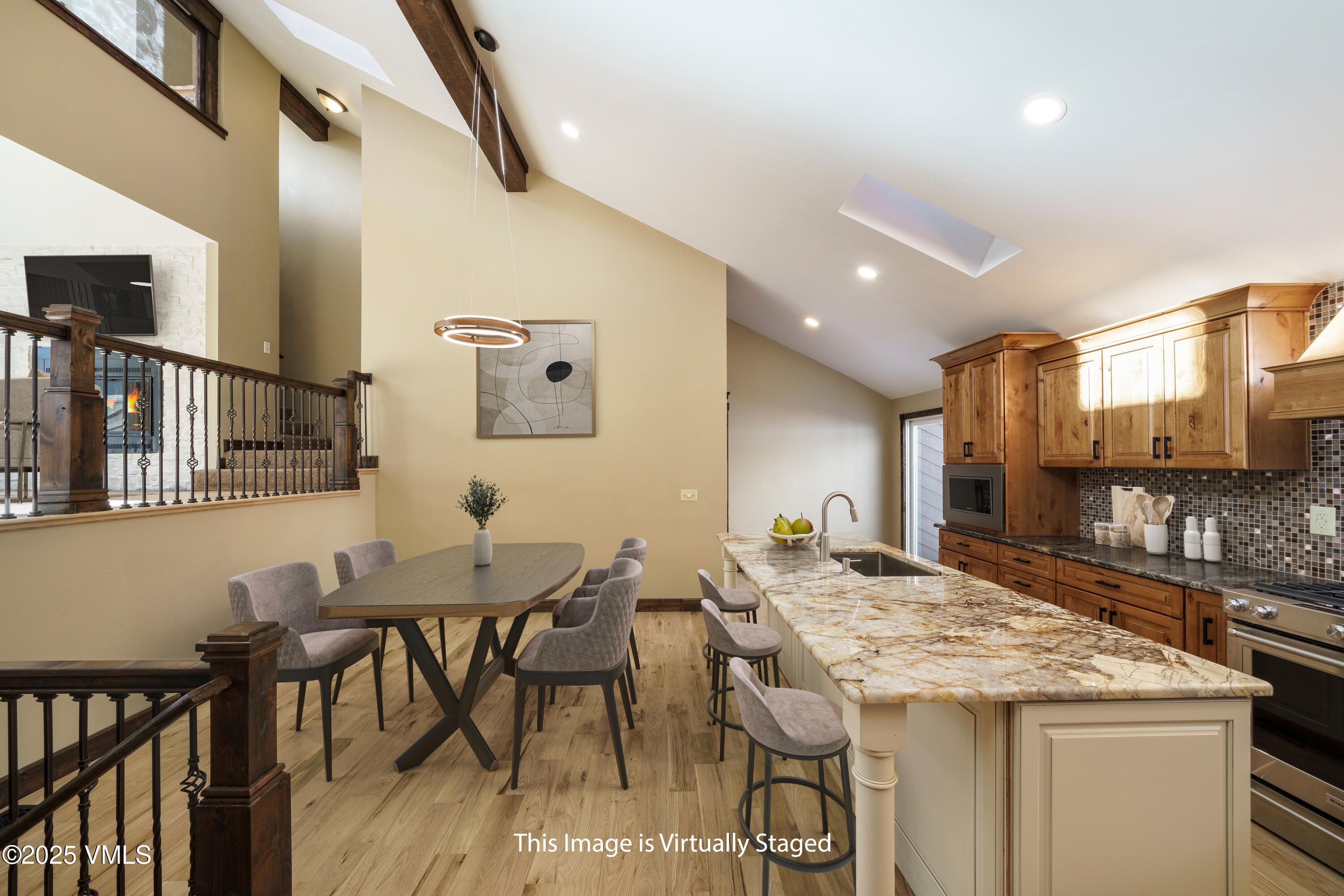 4595 Big Horn Road, Unit 5 Vail, CO 81657 - Photo 10 of 52 a kitchen with a table and chairs in it
