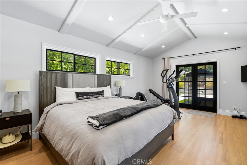 5460 Round Meadow Road Hidden Hills, CA 91302 - Photo 14 of 29 a bed sitting in a spacious bedroom next to a window