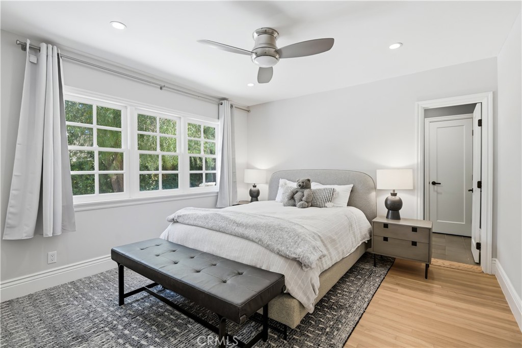 5460 Round Meadow Road Hidden Hills, CA 91302 - Photo 16 of 29 a bedroom with a bed a window and a table