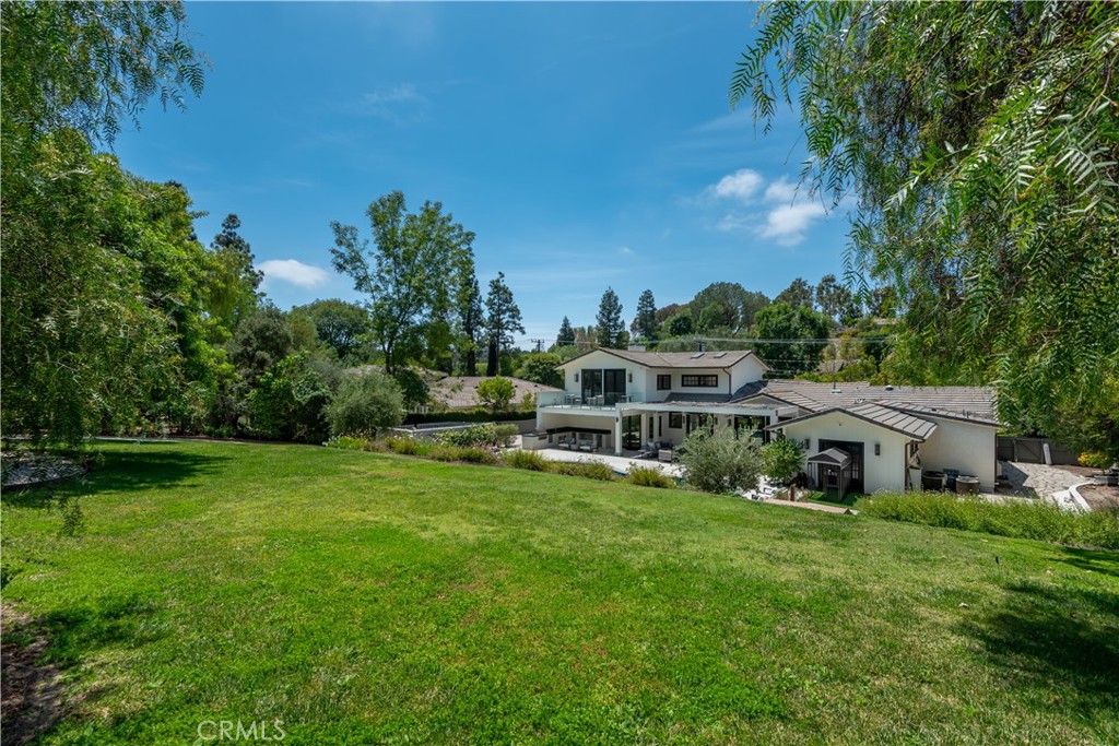 5460 Round Meadow Road Hidden Hills, CA 91302 - Photo 24 of 29 a aerial view of a house with a yard table and chairs