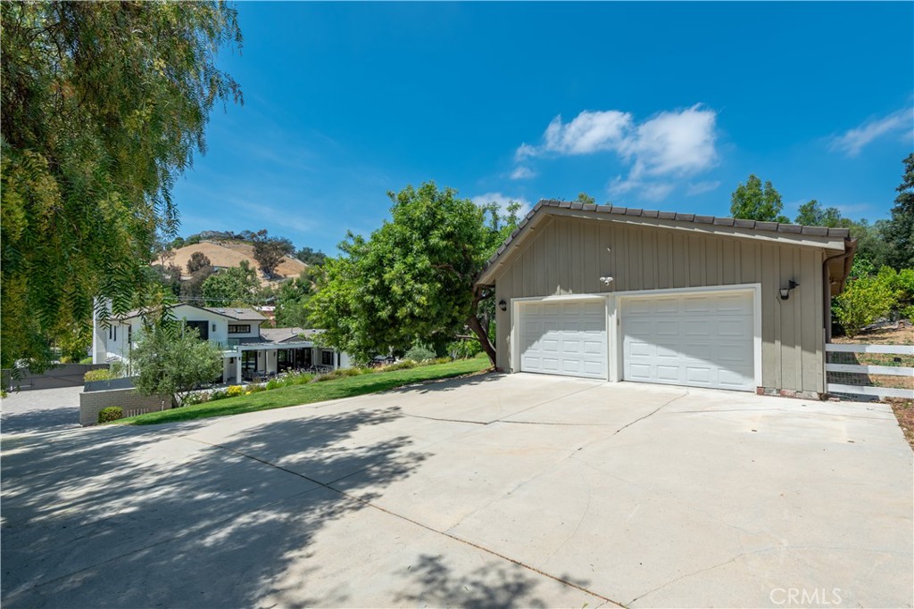 5460 Round Meadow Road Hidden Hills, CA 91302 - Photo 25 of 29 a house with yard in front of it