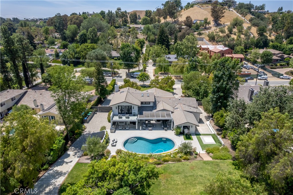 5460 Round Meadow Road Hidden Hills, CA 91302 - Photo 29 of 29 an aerial view of a house with swimming pool and mountains