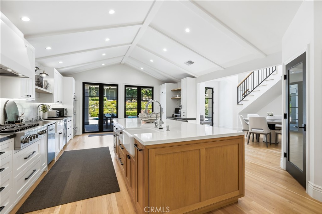 5460 Round Meadow Road Hidden Hills, CA 91302 - Photo 6 of 29 a large white kitchen with a large window