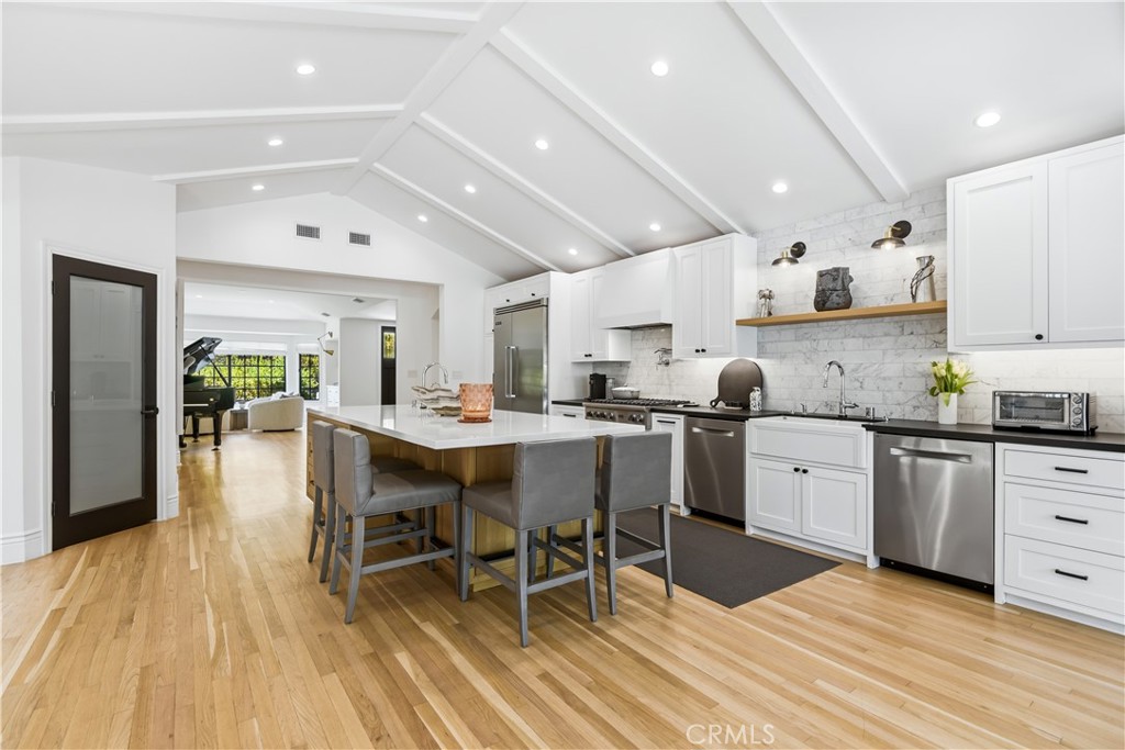 5460 Round Meadow Road Hidden Hills, CA 91302 - Photo 8 of 29 a kitchen with a sink a table and chairs in it
