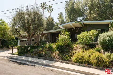 a view of a house with a street