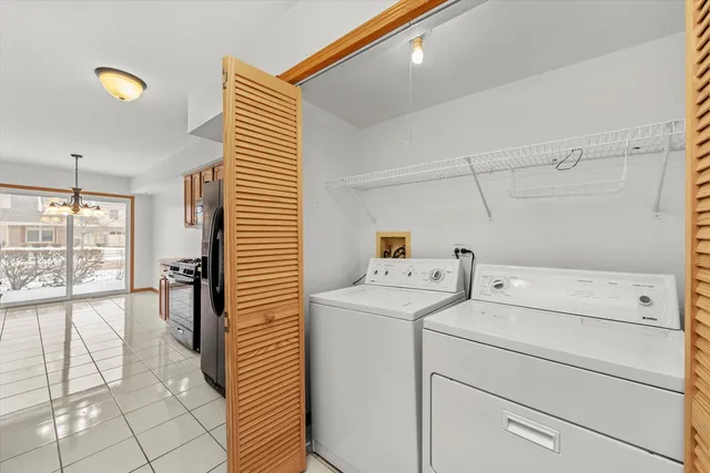 a view of storage and utility room with washer and dryer