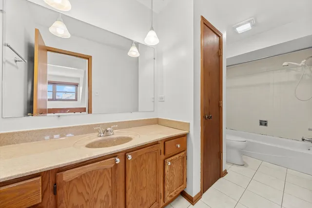 a bathroom with a sink double vanity and a bathtub