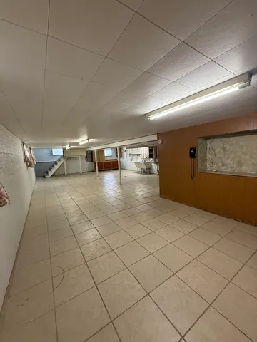 a view of a room with lots of dining table and chairs