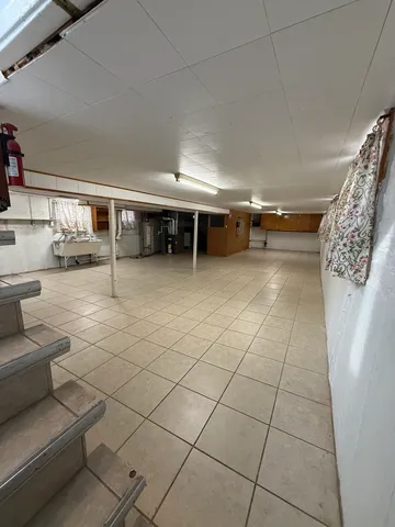 a lobby with furniture and a rug