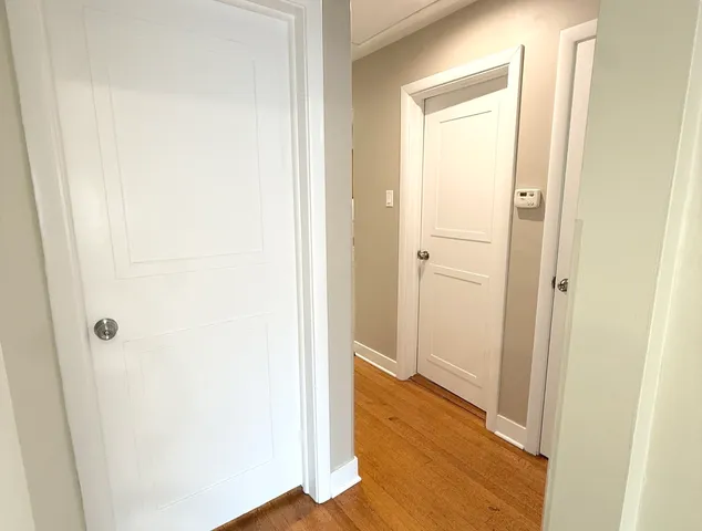 a view of a bathroom with wooden floor