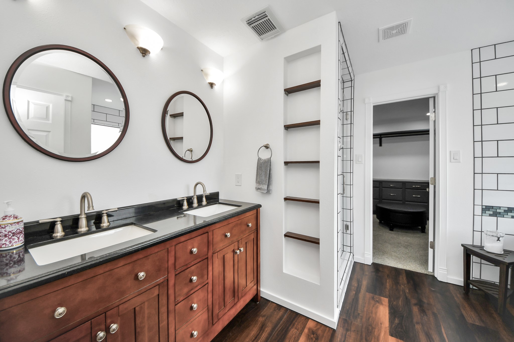 7622 McCormick Mill Court Houston, TX 77095 - Photo 21 of 37 a bathroom with a double vanity sink and a mirror