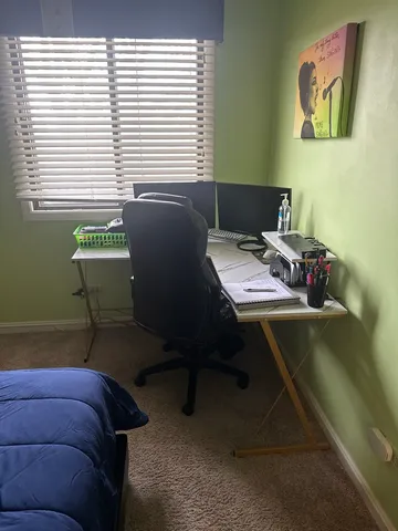 a workspace with furniture and window