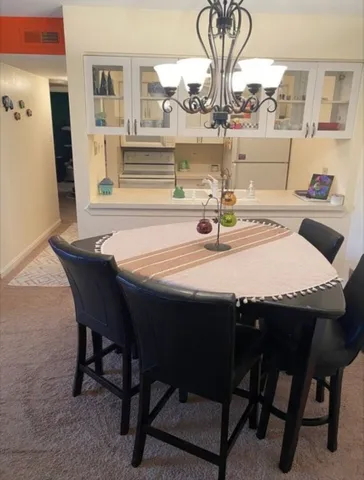 a dining room with furniture and window