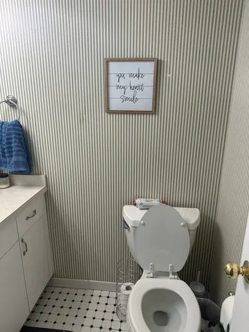 a bathroom with a toilet and a sink