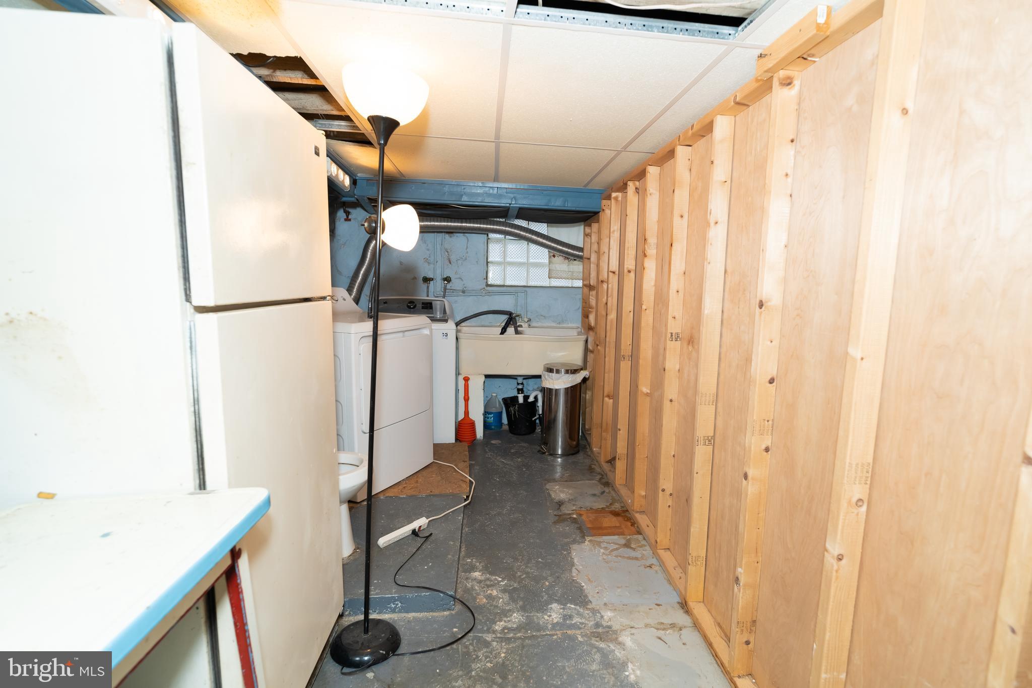 7209 Hazel Avenue Upper Darby, PA 19082 - Photo 16 of 35 a view of a hallway with furniture and refrigerator