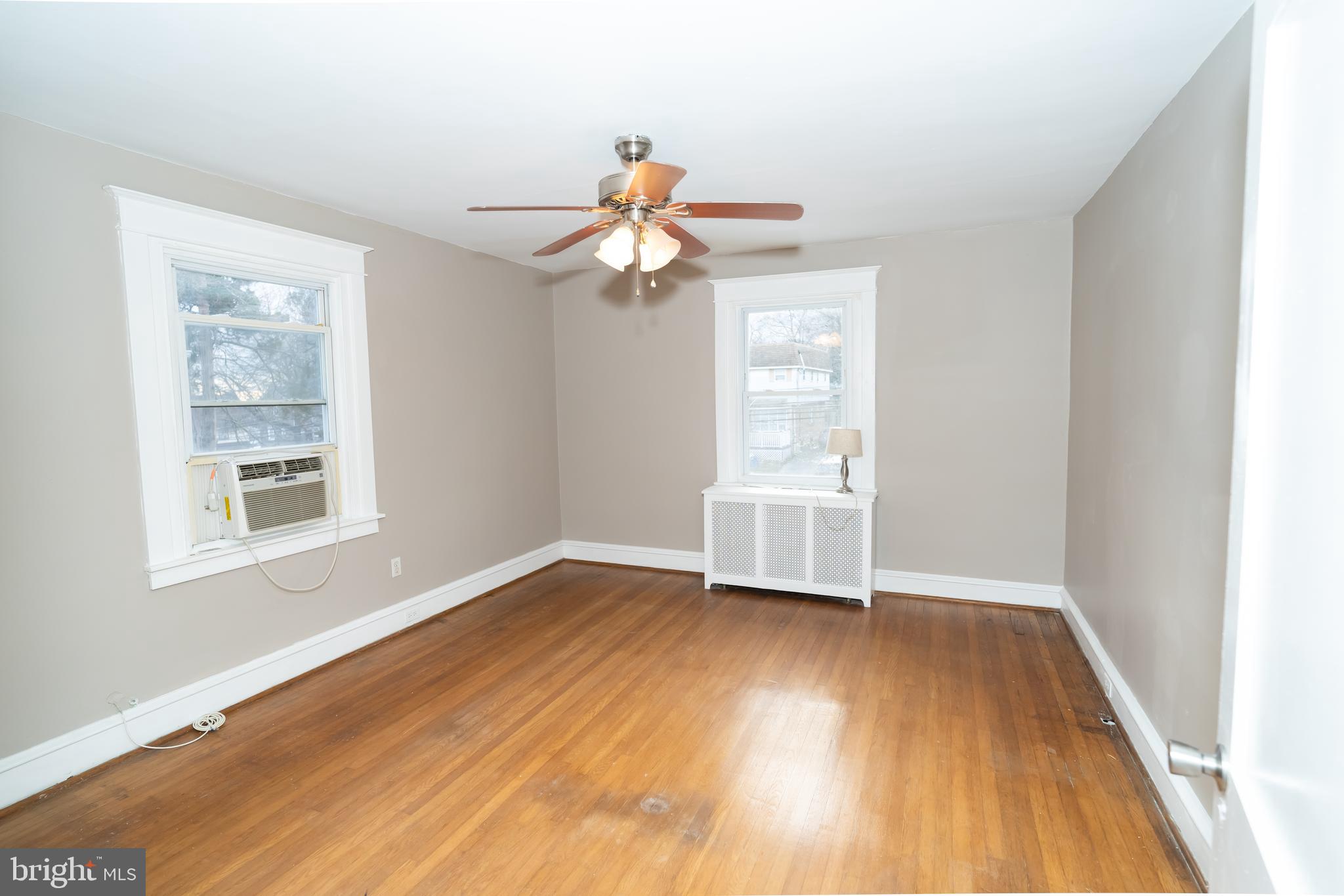 7209 Hazel Avenue Upper Darby, PA 19082 - Photo 21 of 35 wooden floor in an empty room with a window