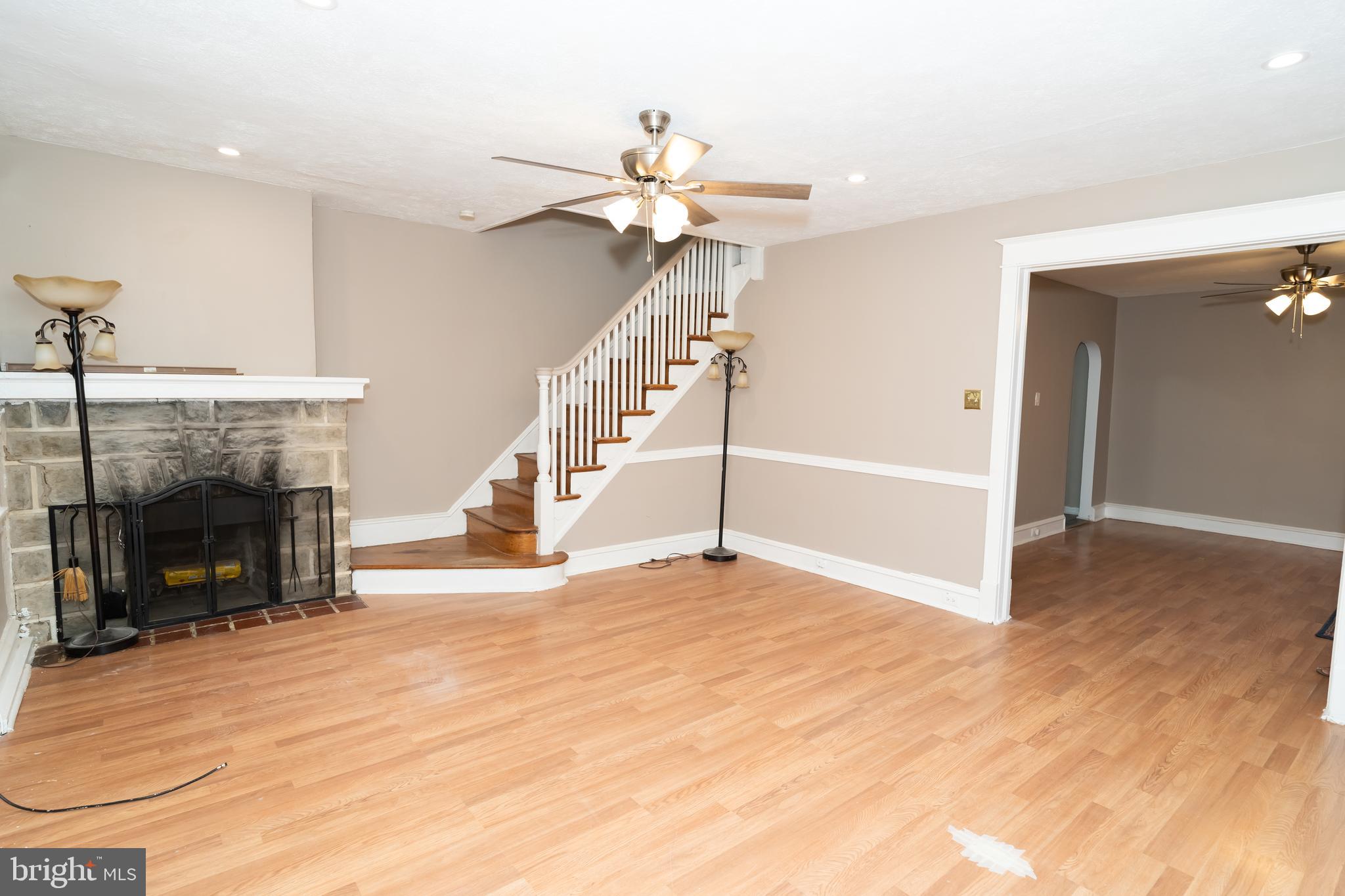 7209 Hazel Avenue Upper Darby, PA 19082 - Photo 9 of 35 a view of empty room with fireplace and fan