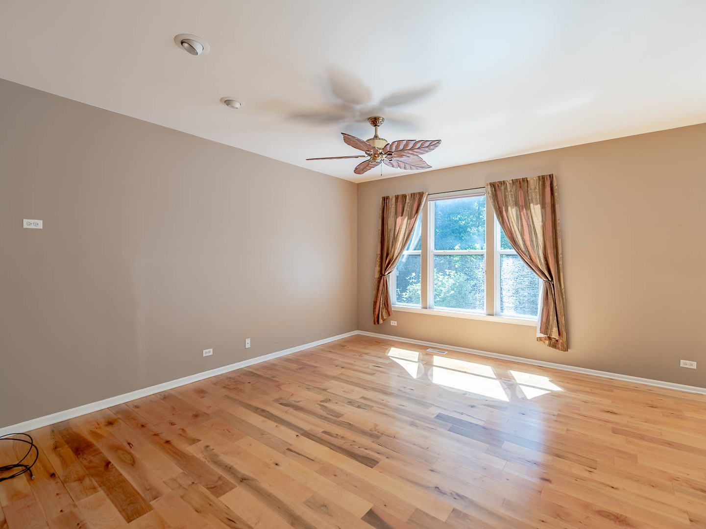 254 Ridge Road North Aurora, IL 60542 - Photo 2 of 14 wooden floor in an empty room with a window