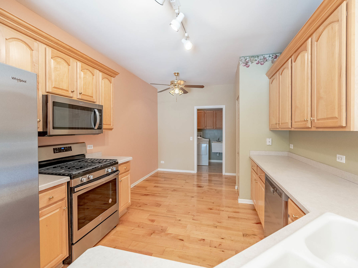254 Ridge Road North Aurora, IL 60542 - Photo 5 of 14 a kitchen with granite countertop a stove top oven and cabinets