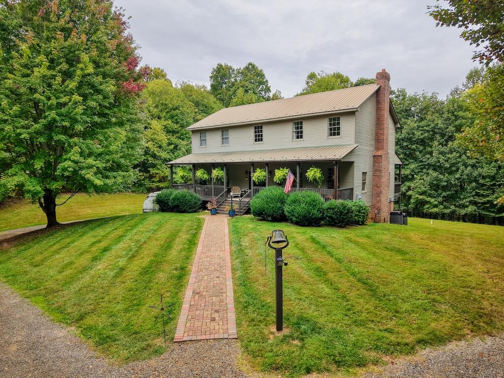 a front view of a house with yard