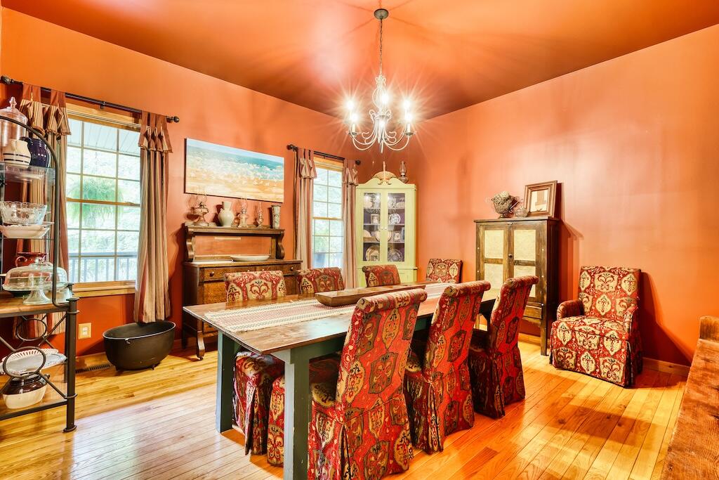 1705 Barberry Road Southeast Floyd, VA 24091 - Photo 13 of 66 a living room with furniture a large window and a dining table