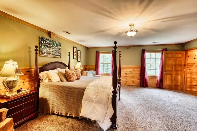 a bed room with a bed and a television