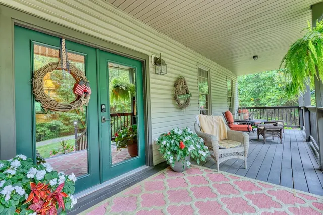 a view of a two chairs in the balcony