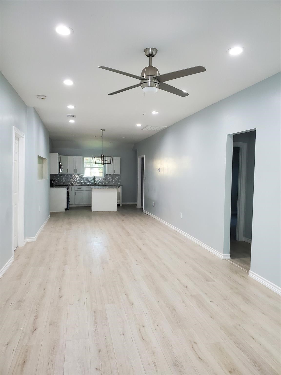 6815 Sidney Street Houston, TX 77021 - Photo 10 of 14 an empty room with closet and windows