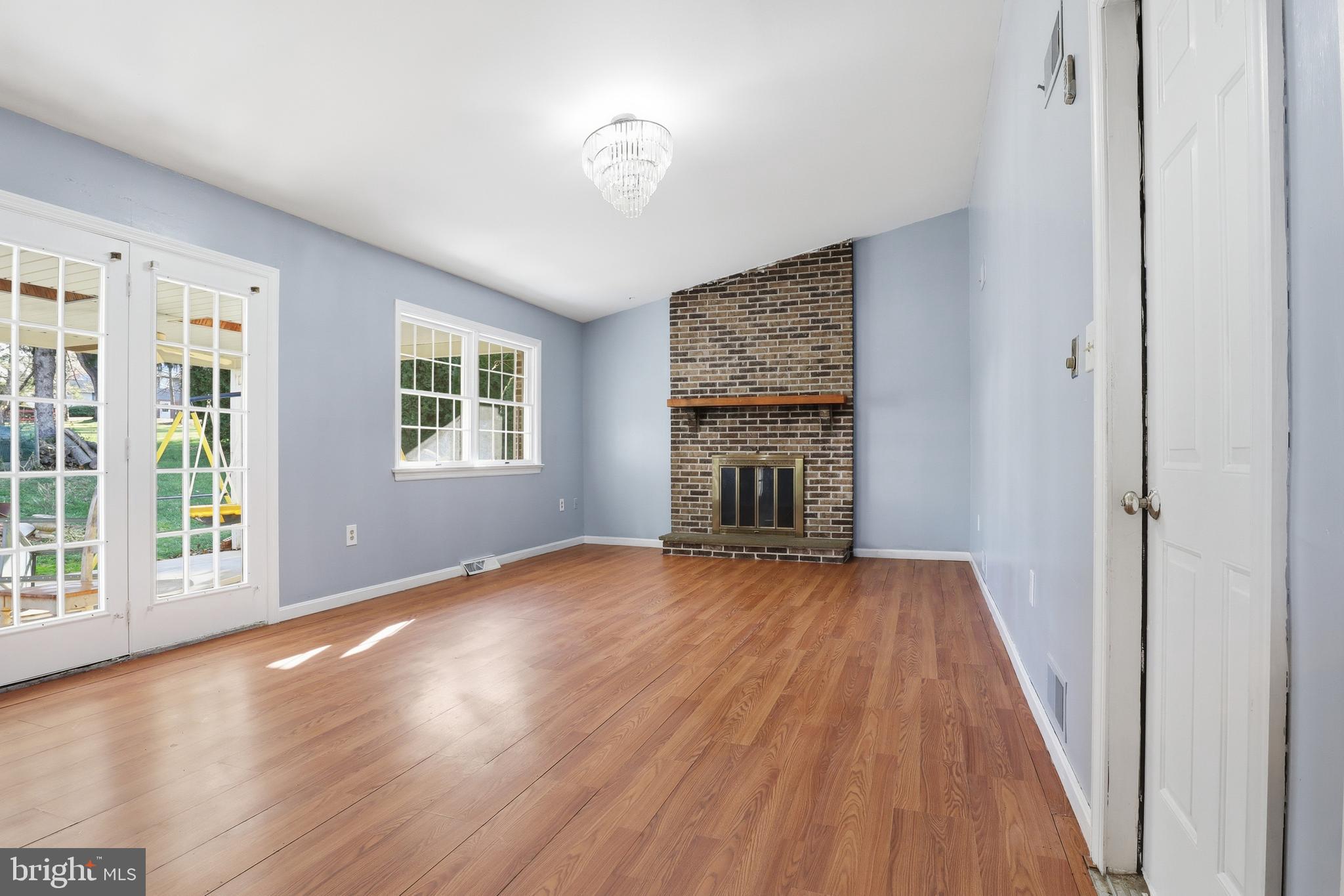 647 Candlewyck Road Lancaster, PA 17601 - Photo 15 of 59 a view of an empty room with wooden floor and a window