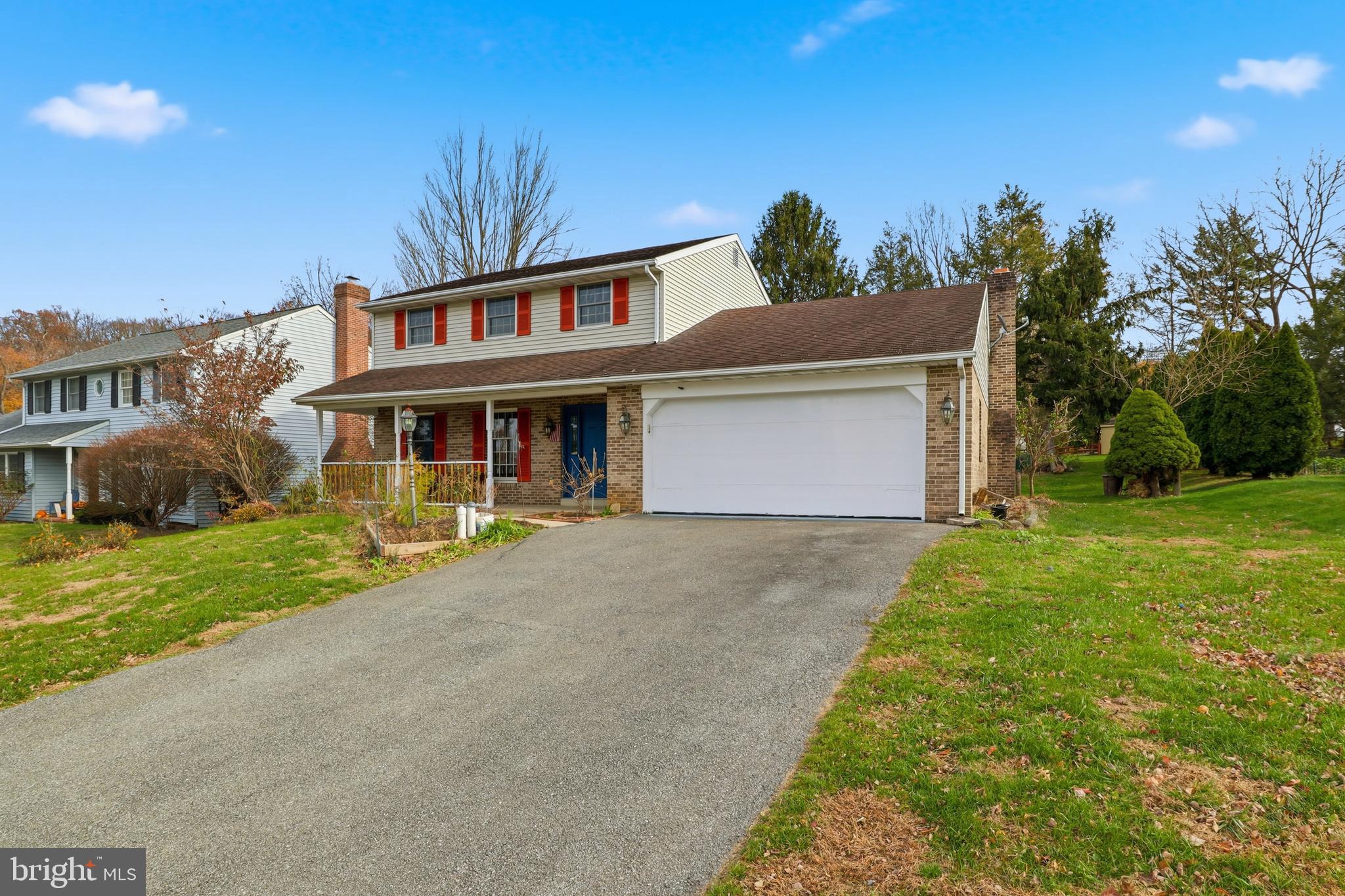 647 Candlewyck Road Lancaster, PA 17601 - Photo 2 of 59 a front view of a house with a yard and potted plants