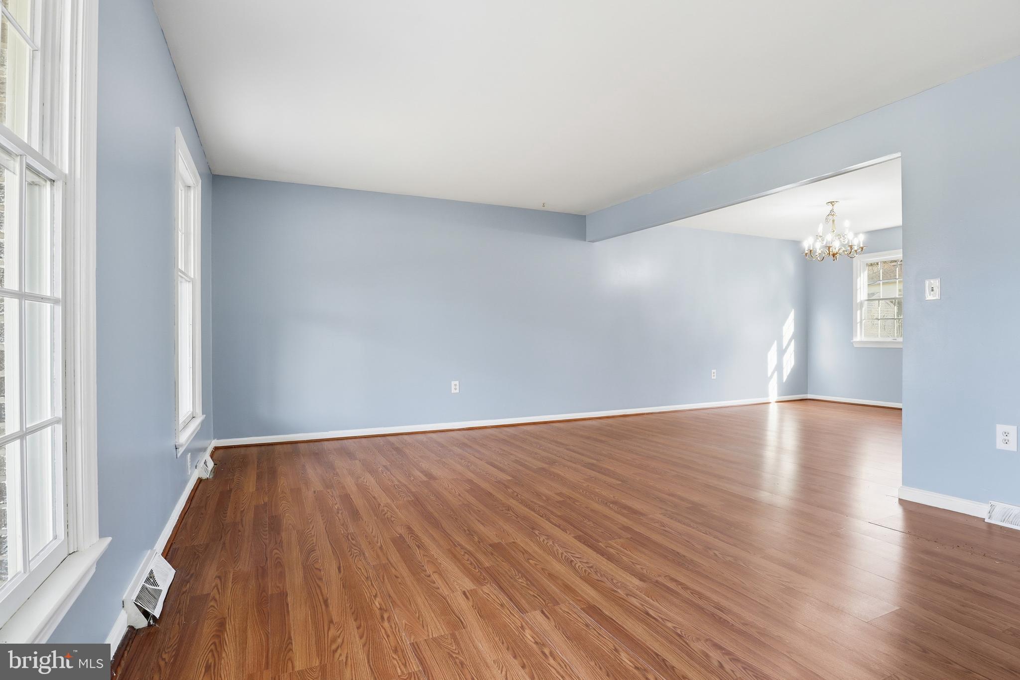 647 Candlewyck Road Lancaster, PA 17601 - Photo 7 of 59 a view of an empty room with wooden floor and a window