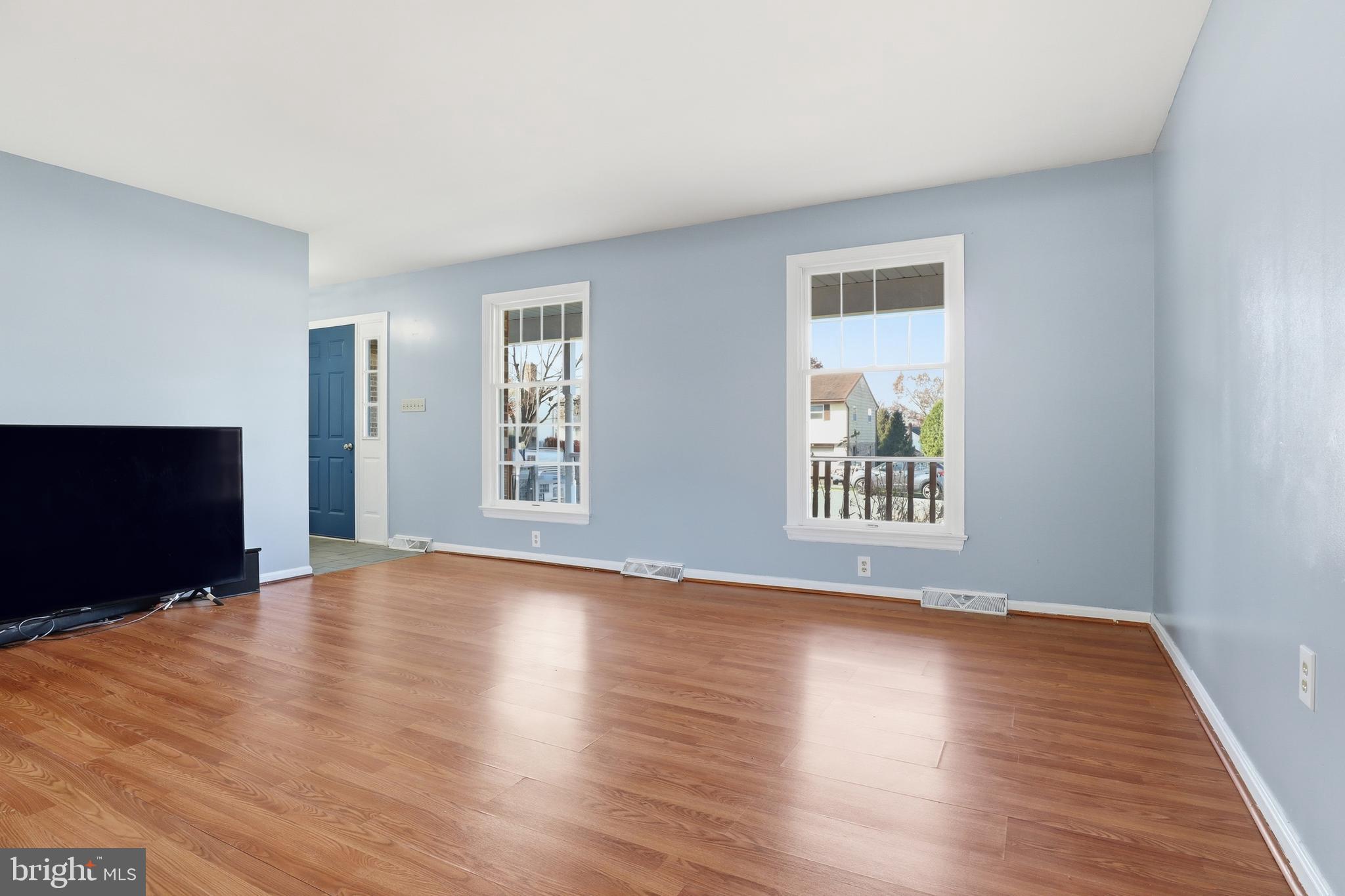 647 Candlewyck Road Lancaster, PA 17601 - Photo 8 of 59 a view of an empty room with wooden floor and a window