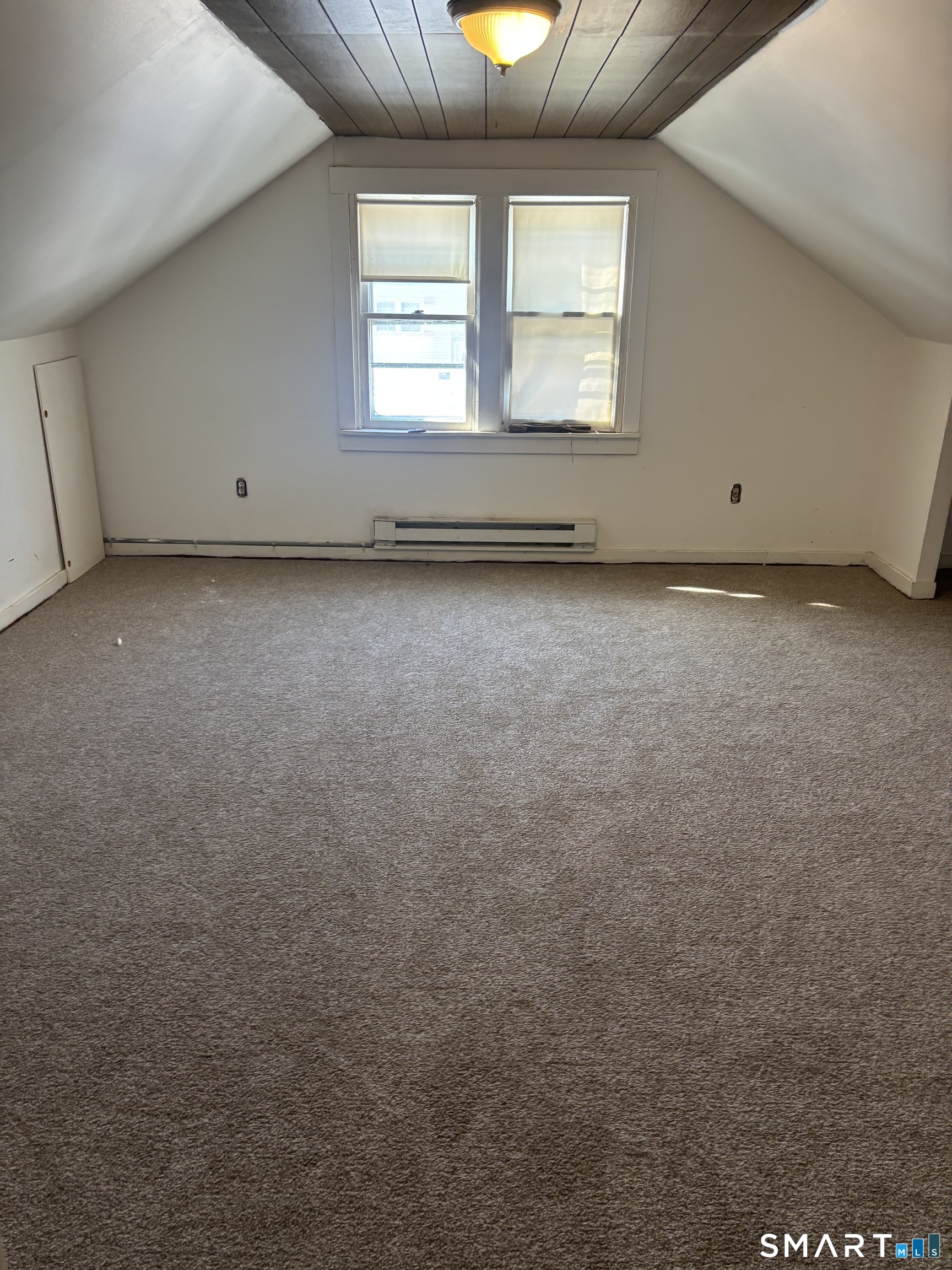 88 Walnut Street East Hartford, CT 06108 - Photo 4 of 8 an empty room with a window