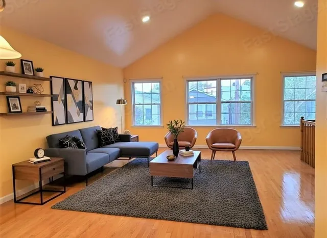 a living room with furniture rug and window