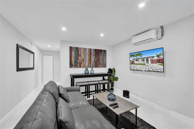 a view of a livingroom with furniture and window