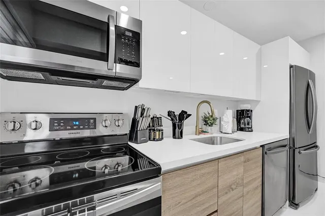 a kitchen with a stove and a microwave