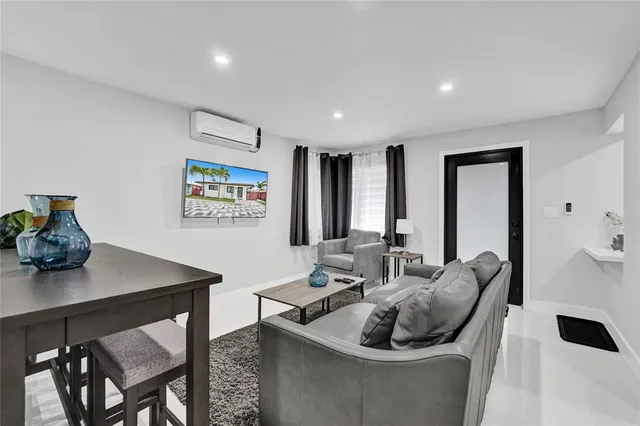 a living room with furniture and a table