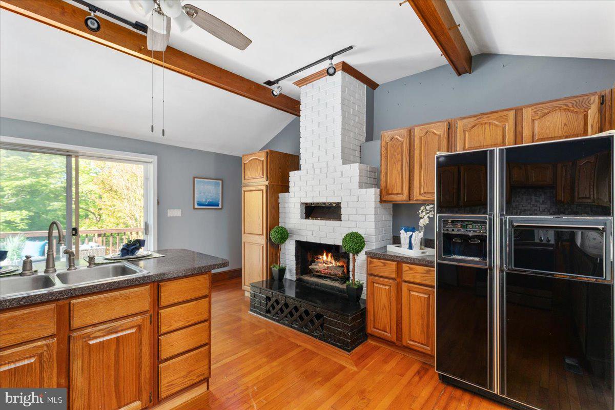 146 Lizzie Mills Road Castleton, VA 22716 - Photo 10 of 91 a kitchen with stainless steel appliances a stove top oven a sink and a refrigerator