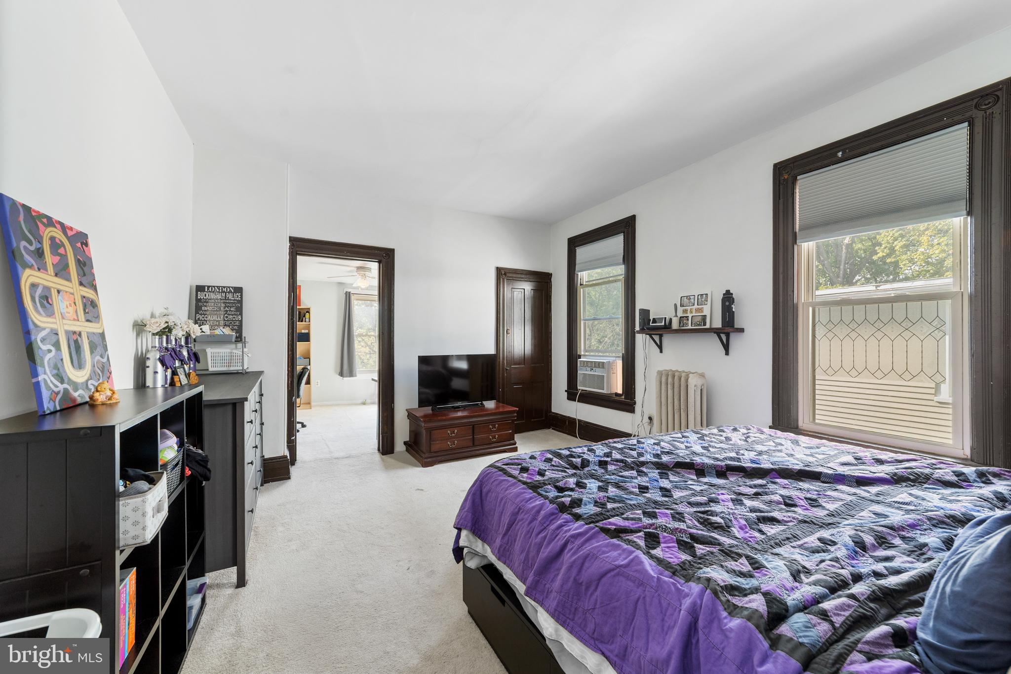 118 Pearl Street Mount Holly, NJ 08060 - Photo 13 of 23 a bedroom with a large bed and a flat tv screen on dresser