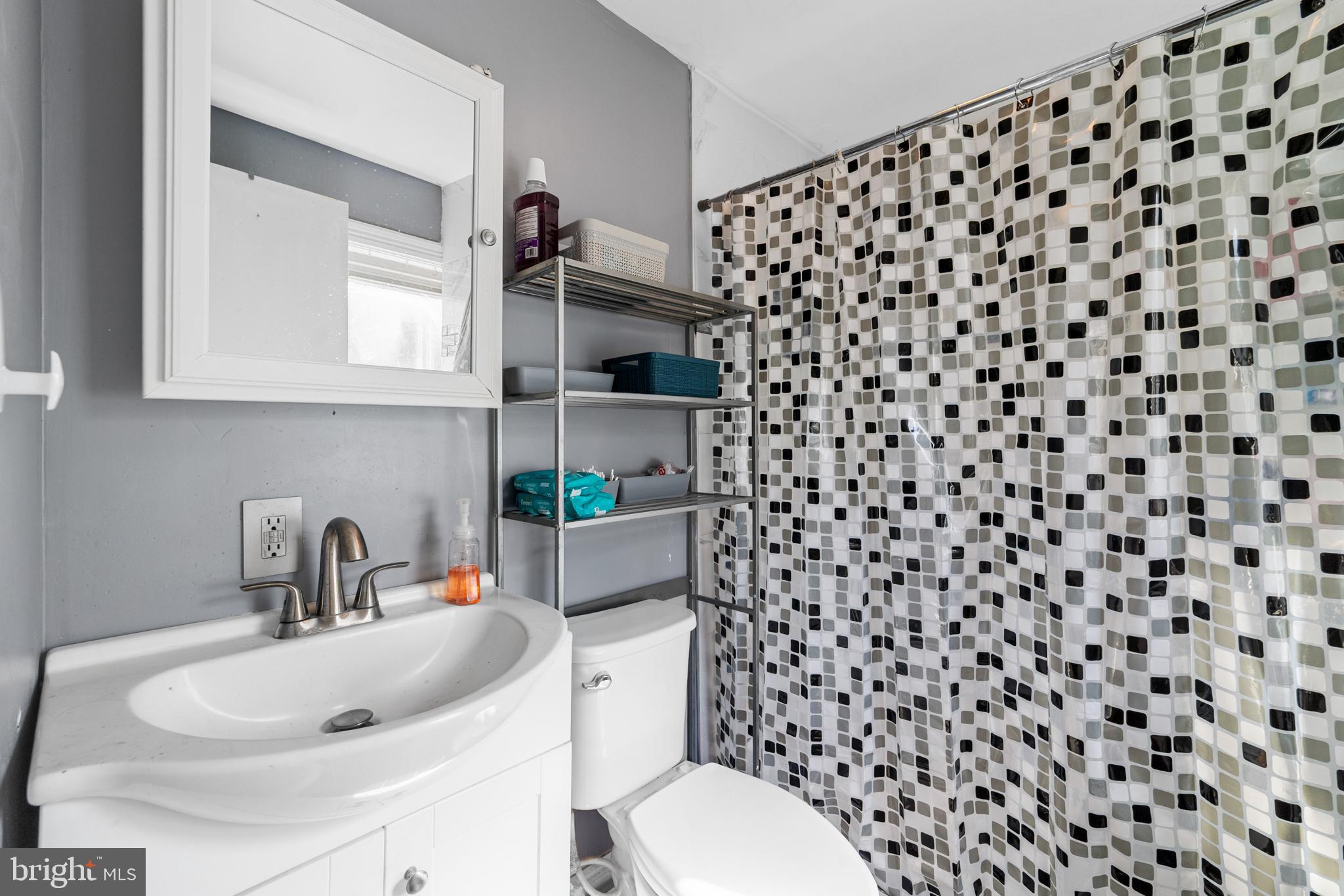 118 Pearl Street Mount Holly, NJ 08060 - Photo 21 of 23 a bathroom with a sink and a toilet