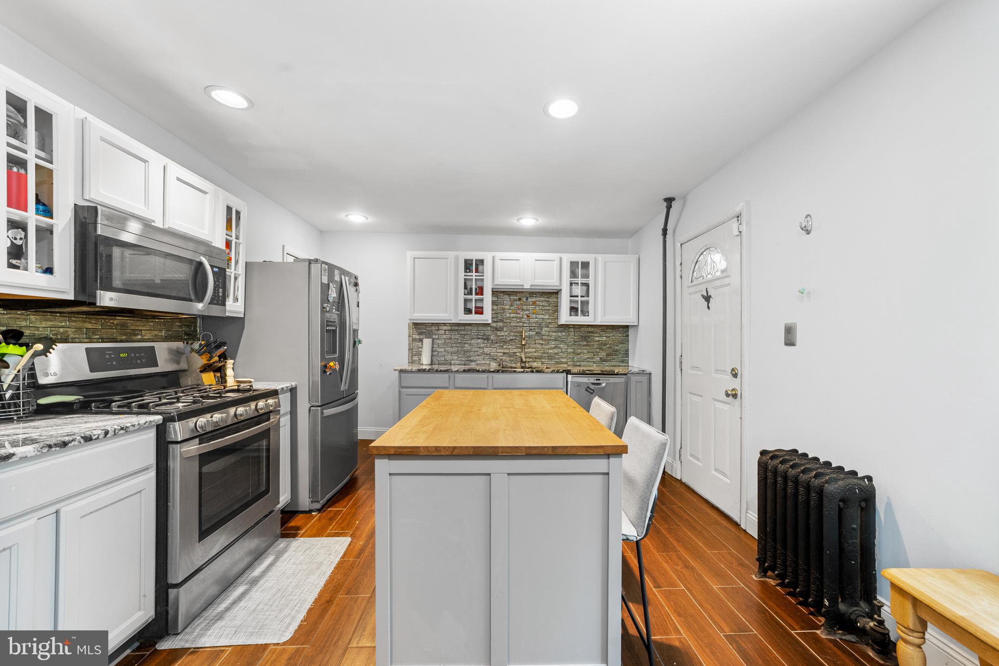 118 Pearl Street Mount Holly, NJ 08060 - Photo 6 of 23 a kitchen with stainless steel appliances granite countertop a sink and a stove