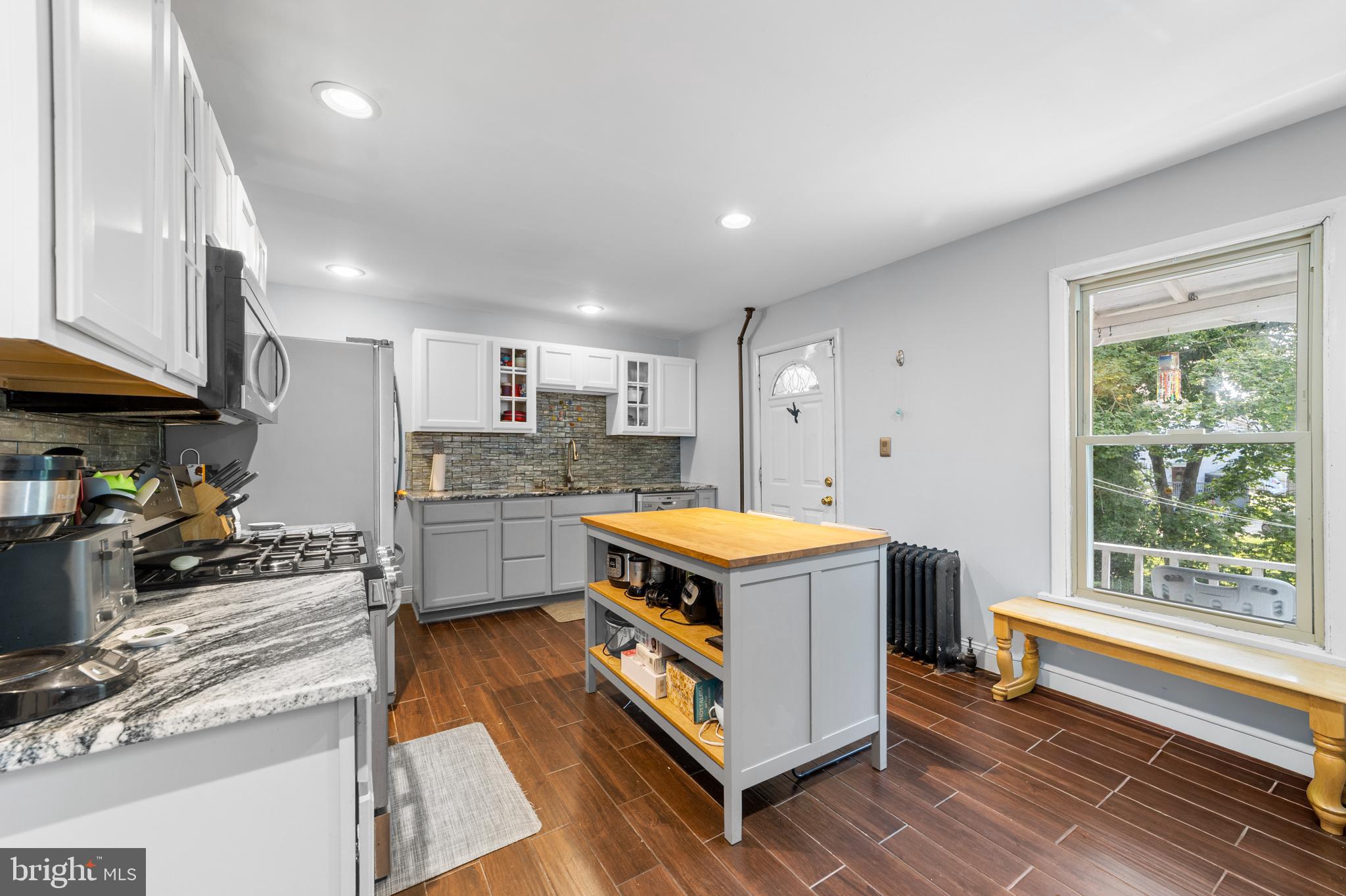 118 Pearl Street Mount Holly, NJ 08060 - Photo 7 of 23 a kitchen with a stove and a refrigerator