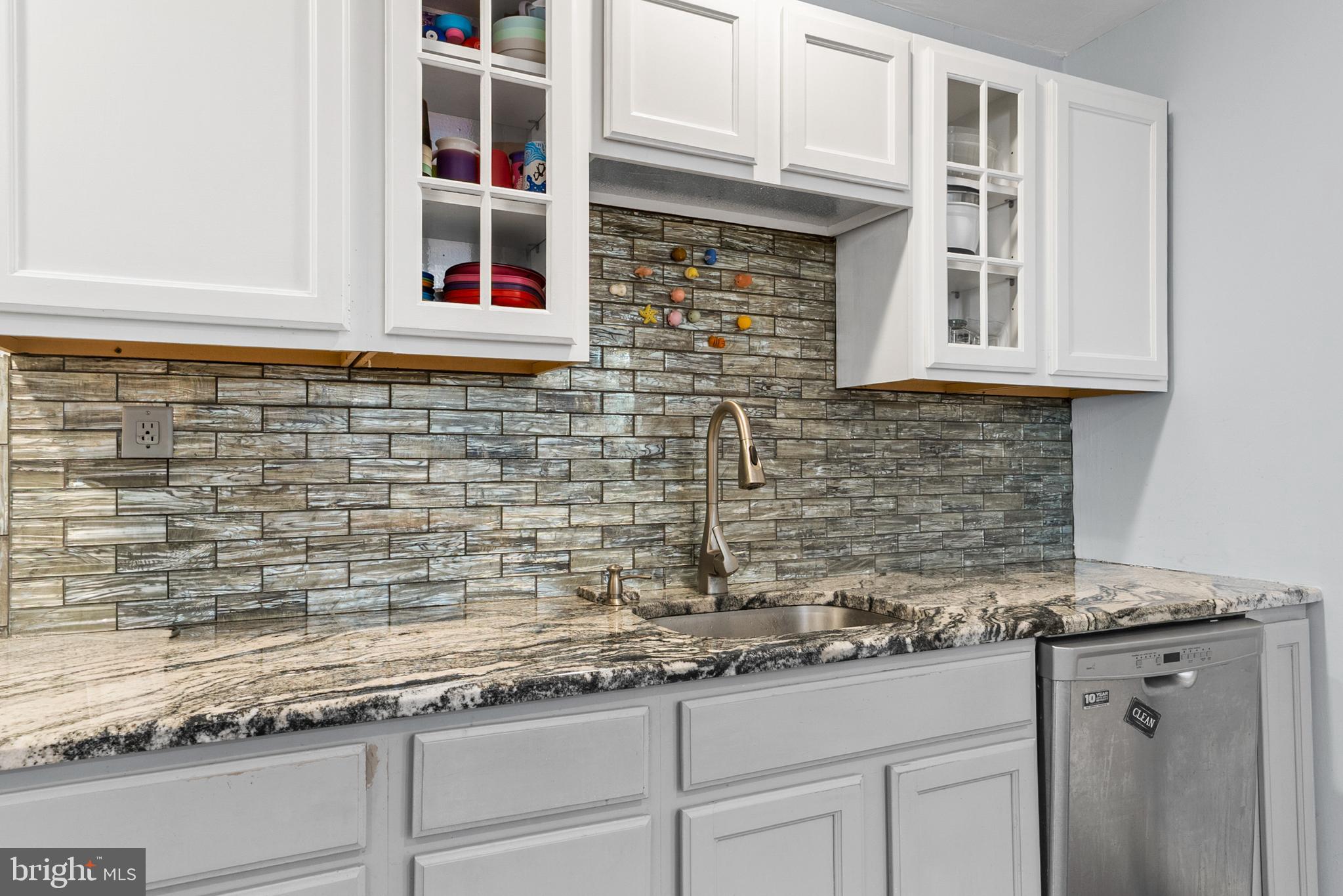 118 Pearl Street Mount Holly, NJ 08060 - Photo 8 of 23 a kitchen with granite countertop a sink and cabinets