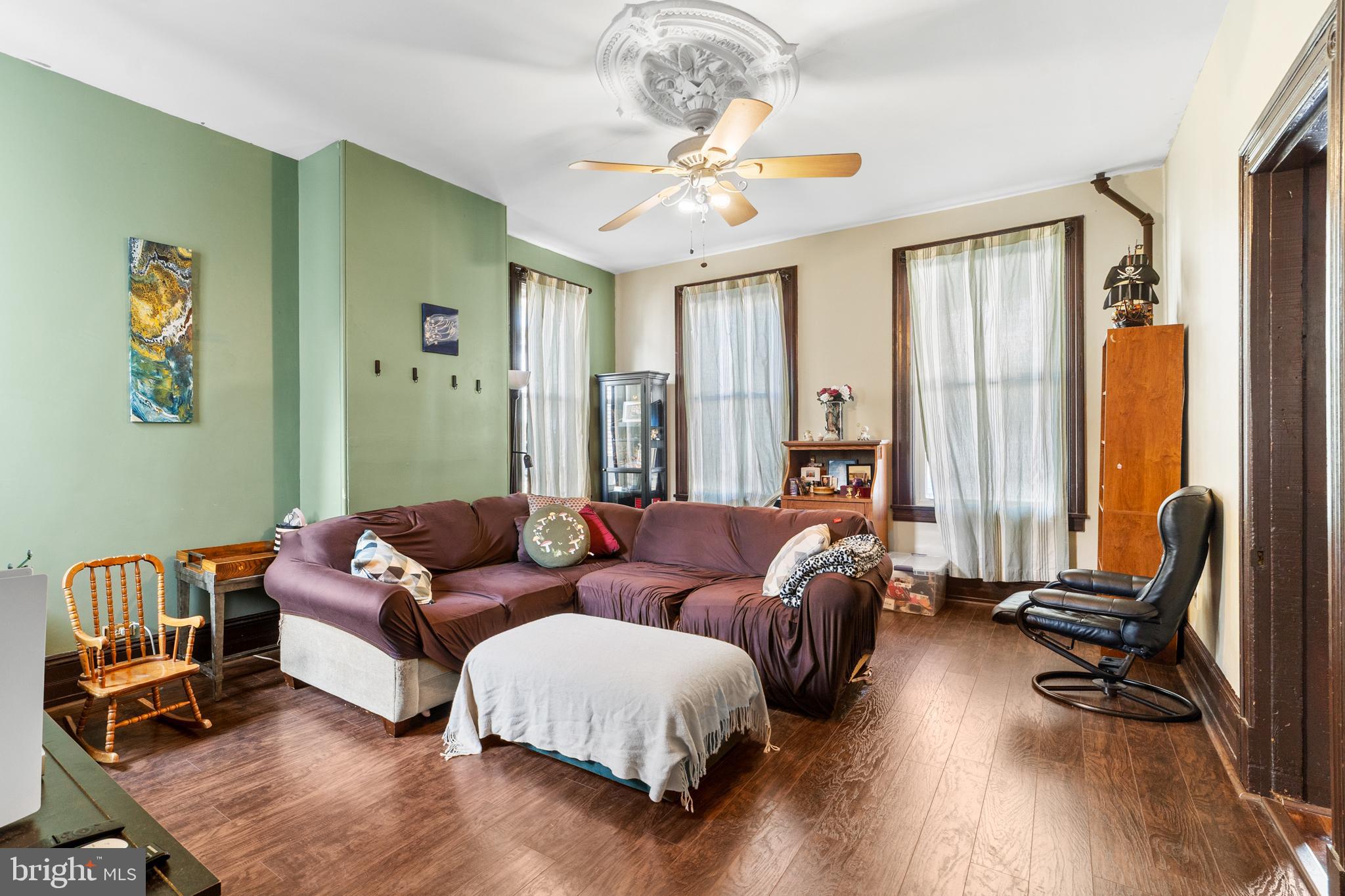 118 Pearl Street Mount Holly, NJ 08060 - Photo 10 of 23 a living room with furniture and a large window
