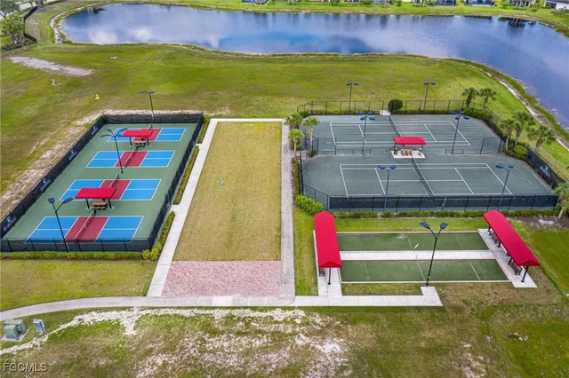 an aerial view of residential house with outdoor space and pool
