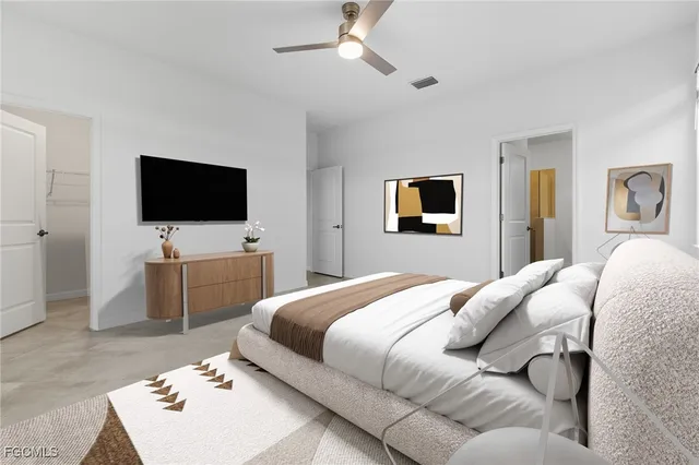 a view of a livingroom with a ceiling fan and window