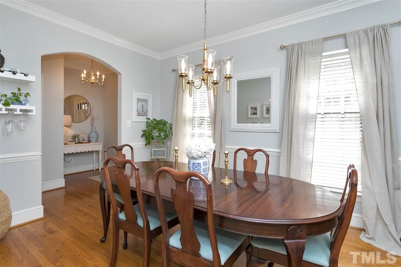 4132 Betterton Drive Raleigh, NC 27613 - Photo 3 of 28 a view of a a dining room with furniture window and wooden floor