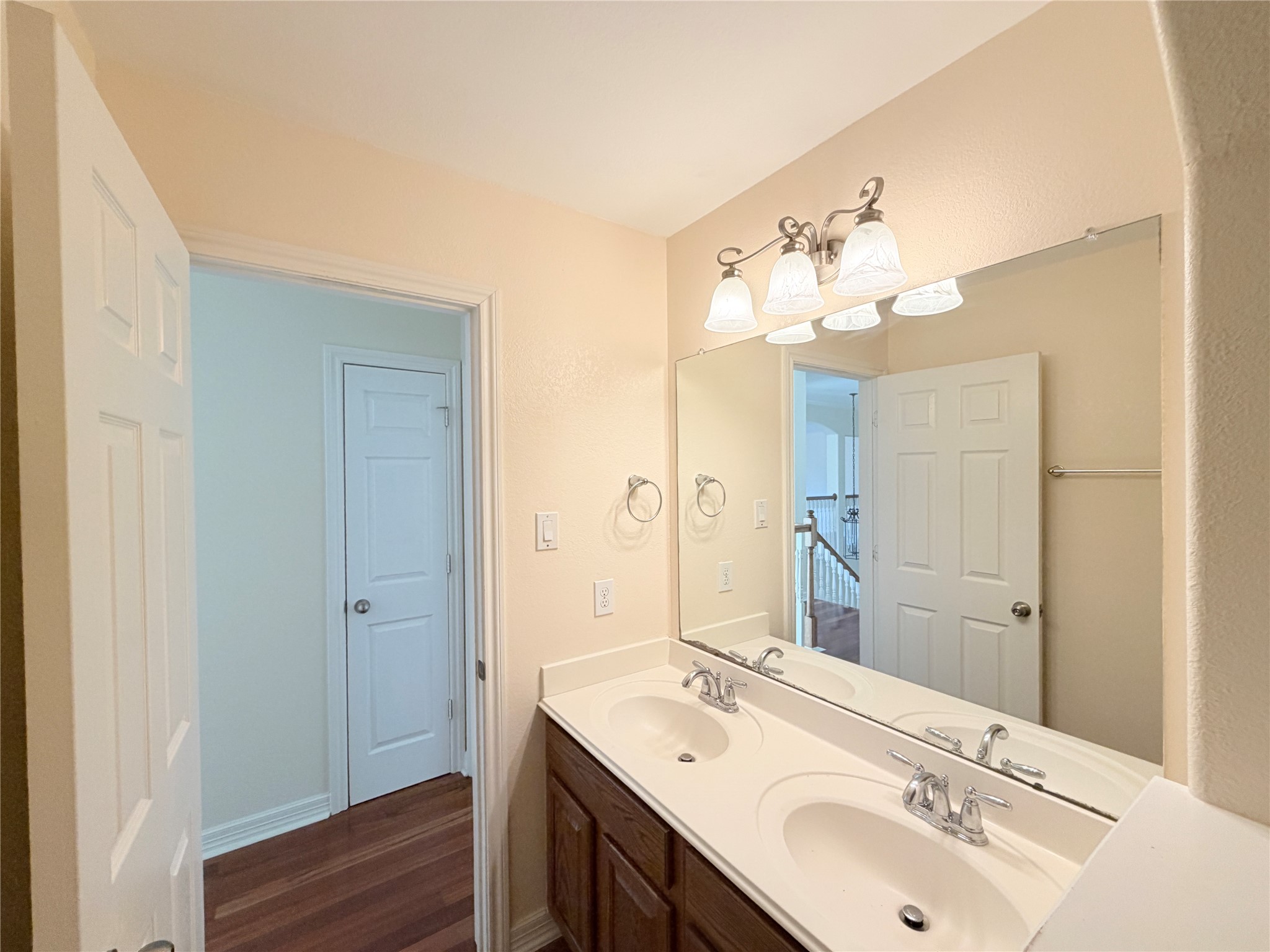 28015 Silverstream Court Fulshear, TX 77441 - Photo 29 of 33 a bathroom with a sink and a mirror