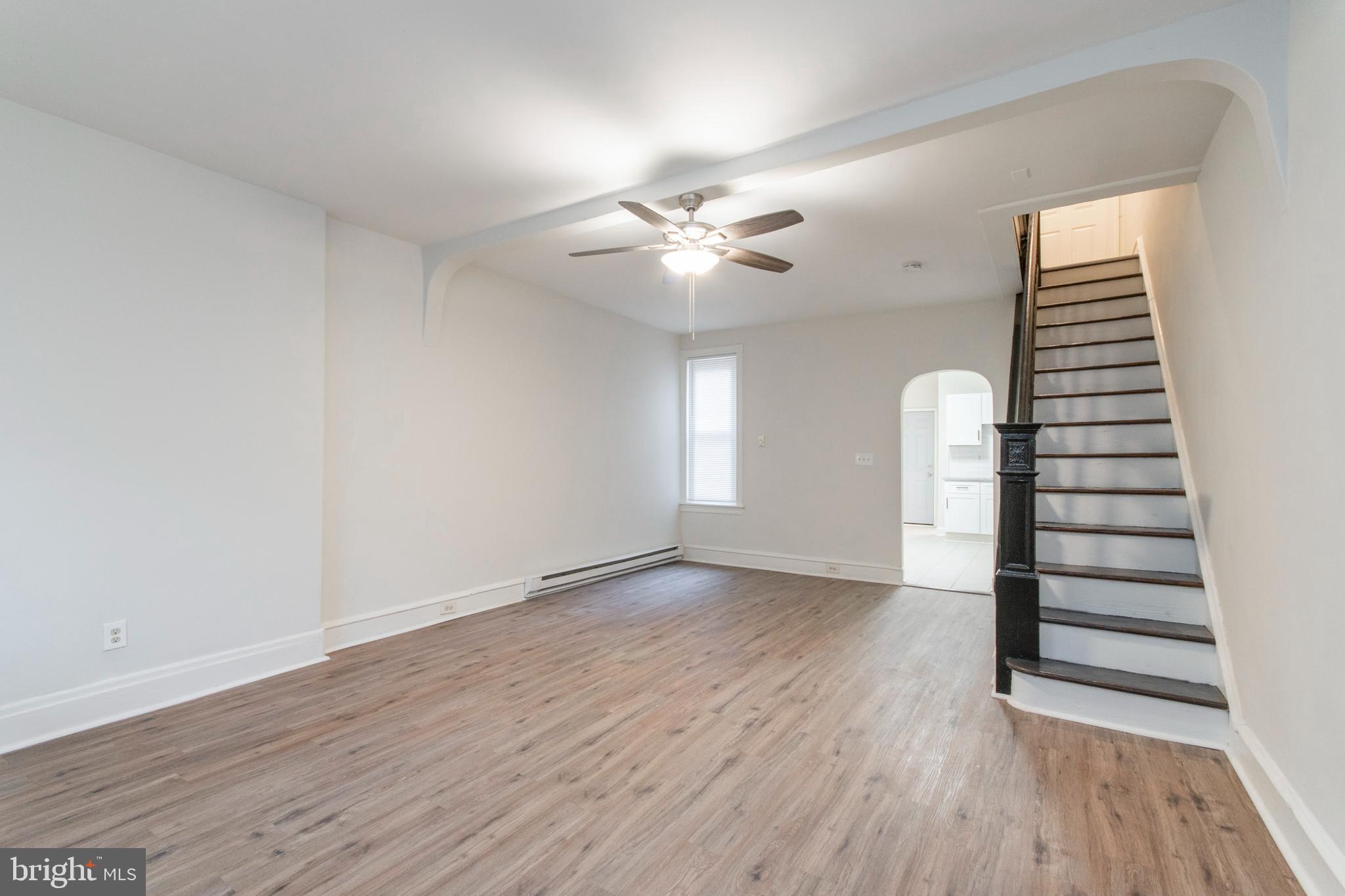 725 West Luzerne Street Philadelphia, PA 19140 - Photo 2 of 23 wooden floor in an empty room with a window