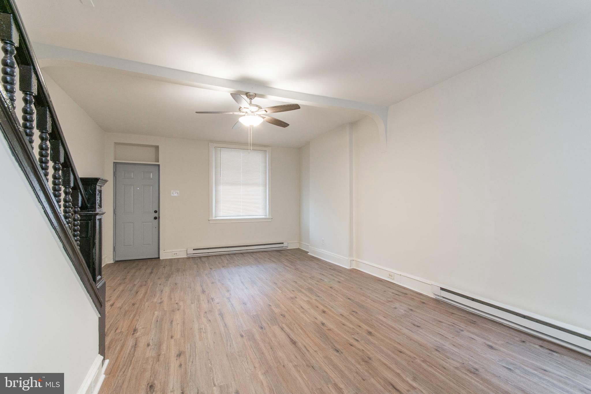 725 West Luzerne Street Philadelphia, PA 19140 - Photo 5 of 23 wooden floor in an empty room with a window